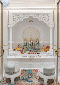 Home interiors shift with every passing season. Colour palettes change, furniture styles evolve, and what felt contemporary five years ago can look dated today. Yet some pooja rooms seem to exist outside this cycle entirely. They age without looking old. The reason, more often than not, comes down to how they were built and what they were built with. When a space is designed around material quality rather than momentary trends, the result holds up differently over time. A luxury marble pooja room carries an inherent permanence that trend-led décor cannot replicate. The stone tells a story that does not go out of fashion. Its natural veining, quiet weight, and subdued authority create a spiritual atmosphere that feels as relevant a decade from now as it does today. When Material Becomes the Design The Problem With Trend-Led Spaces: Many homeowners invest heavily in décor that photographs beautifully but ages poorly. A pooja room built around a particular colour trend or popular finish will eventually demand updating. That cycle is costly, and perhaps more importantly, it chips away at the sanctity a prayer space deserves. The atmosphere of a sacred corner should not depend on what is in fashion that year. Why Stone Outlasts Style: Natural marble carries its own visual identity, quite independent of design fashions. The variation within each slab, the subtle shifts in tone, and the texture that changes with light are qualities no engineered surface fully replicates. A space built around genuine stone stops being a design statement and starts being something deeper. That is a distinction that matters more than most people initially realise. What Marble Actually Brings to a Sacred Space Durability That Reads as Permanence: Marble's crystalline structure gives it a density and longevity that softer materials cannot match. A well-maintained marble surface resists the kind of wear that visibly degrades most interiors over time. This is not only about aesthetics. It is about creating a space that looks as considered in twenty years as it does on installation day. That quality is worth planning for from the outset. The Spiritual Weight of Natural Stone: There is something about genuine marble that synthetic materials have never fully captured. The coolness of the surface, the way light settles differently across carved stone, the sense that the material carries real age and intention. These qualities contribute to an atmosphere of devotion that goes beyond visual appeal. A space built in natural stone feels different to stand in, and in a sacred context, that matters. Craftsmanship as the Third Dimension: Beyond the material itself, the quality of workmanship determines how a stone surface ages. A poorly finished marble surface will show its limitations within years. Skilled carving, proper surface finishing, and precise joinery create a result that looks considered rather than constructed. The difference between average and expert work becomes clearer over time, not less so. That is the craftsmanship argument. Elements That Carry a Room Across Decades The Enduring Power of Hand Carving: Carved floral motifs reference classical temple architecture, grounding a space in cultural continuity rather than passing trends. Geometric inlay work in contrasting marble tones creates visual rhythm that remains pleasing regardless of surrounding décor changes. Pillar detailing and arched niches introduce proportion and depth that the eye finds naturally satisfying over long periods. Fine relief carving on temple panels reflects light differently as the day progresses, keeping the space visually alive without any alterations to the room. Marble Inlay and the Language of Pattern: The technique of setting contrasting stone pieces into a base surface, a practice with centuries of history in Indian temple architecture, produces patterns that read as artful rather than decorative. Unlike applied finishes or surface prints, inlays are permanent. They become more appreciated as the room ages, not less. That quality is genuinely rare in any interior material. Balance Over Ornamentation: The longest-lasting pooja rooms are not necessarily the most elaborate. What makes a space endure is balance. The proportion of carving to a plain surface, the scale of the temple relative to the room, and the way sacred geometry informs the overall layout are the decisions that separate a space which ages gracefully from one that starts to feel heavy or overwrought over time. Spiritual Relevance Does Not Expire A Space That Grows With the Family: A well-designed marble pooja room tends to feel more significant over time, not less. As rituals accumulate and the space becomes part of daily life, its physical quality begins to matter in ways that are difficult to articulate but easy to feel. A space that holds up structurally and aesthetically becomes a site of genuine continuity, and that quality cannot be purchased with trend-led choices. The Cost of Getting It Wrong: Choosing cheaper materials for a pooja room may feel like a reasonable short-term decision. Over years, the discolouration, surface wear, and general deterioration begin to undermine the atmosphere entirely. A space that looked clean on your installation day can feel shabby within a few years. The investment in quality stone protects the spiritual character of the room across years of daily use. Stone That Still Speaks, Years From Now A pooja room built with genuine intent and quality materials rarely needs to be reconsidered. It simply continues to serve its purpose. If you are planning a sacred space and want it to carry that kind of longevity, connect with a specialist who understands both the material and the design principles that make marble pooja rooms last, not just for years, but across generations.