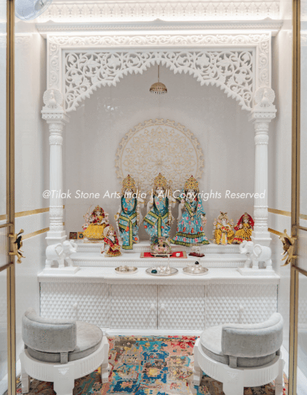 Home interiors shift with every passing season. Colour palettes change, furniture styles evolve, and what felt contemporary five years ago can look dated today. Yet some pooja rooms seem to exist outside this cycle entirely. They age without looking old. The reason, more often than not, comes down to how they were built and what they were built with. When a space is designed around material quality rather than momentary trends, the result holds up differently over time. A luxury marble pooja room carries an inherent permanence that trend-led décor cannot replicate. The stone tells a story that does not go out of fashion. Its natural veining, quiet weight, and subdued authority create a spiritual atmosphere that feels as relevant a decade from now as it does today. When Material Becomes the Design The Problem With Trend-Led Spaces: Many homeowners invest heavily in décor that photographs beautifully but ages poorly. A pooja room built around a particular colour trend or popular finish will eventually demand updating. That cycle is costly, and perhaps more importantly, it chips away at the sanctity a prayer space deserves. The atmosphere of a sacred corner should not depend on what is in fashion that year. Why Stone Outlasts Style: Natural marble carries its own visual identity, quite independent of design fashions. The variation within each slab, the subtle shifts in tone, and the texture that changes with light are qualities no engineered surface fully replicates. A space built around genuine stone stops being a design statement and starts being something deeper. That is a distinction that matters more than most people initially realise. What Marble Actually Brings to a Sacred Space Durability That Reads as Permanence: Marble's crystalline structure gives it a density and longevity that softer materials cannot match. A well-maintained marble surface resists the kind of wear that visibly degrades most interiors over time. This is not only about aesthetics. It is about creating a space that looks as considered in twenty years as it does on installation day. That quality is worth planning for from the outset. The Spiritual Weight of Natural Stone: There is something about genuine marble that synthetic materials have never fully captured. The coolness of the surface, the way light settles differently across carved stone, the sense that the material carries real age and intention. These qualities contribute to an atmosphere of devotion that goes beyond visual appeal. A space built in natural stone feels different to stand in, and in a sacred context, that matters. Craftsmanship as the Third Dimension: Beyond the material itself, the quality of workmanship determines how a stone surface ages. A poorly finished marble surface will show its limitations within years. Skilled carving, proper surface finishing, and precise joinery create a result that looks considered rather than constructed. The difference between average and expert work becomes clearer over time, not less so. That is the craftsmanship argument. Elements That Carry a Room Across Decades The Enduring Power of Hand Carving: Carved floral motifs reference classical temple architecture, grounding a space in cultural continuity rather than passing trends. Geometric inlay work in contrasting marble tones creates visual rhythm that remains pleasing regardless of surrounding décor changes. Pillar detailing and arched niches introduce proportion and depth that the eye finds naturally satisfying over long periods. Fine relief carving on temple panels reflects light differently as the day progresses, keeping the space visually alive without any alterations to the room. Marble Inlay and the Language of Pattern: The technique of setting contrasting stone pieces into a base surface, a practice with centuries of history in Indian temple architecture, produces patterns that read as artful rather than decorative. Unlike applied finishes or surface prints, inlays are permanent. They become more appreciated as the room ages, not less. That quality is genuinely rare in any interior material. Balance Over Ornamentation: The longest-lasting pooja rooms are not necessarily the most elaborate. What makes a space endure is balance. The proportion of carving to a plain surface, the scale of the temple relative to the room, and the way sacred geometry informs the overall layout are the decisions that separate a space which ages gracefully from one that starts to feel heavy or overwrought over time. Spiritual Relevance Does Not Expire A Space That Grows With the Family: A well-designed marble pooja room tends to feel more significant over time, not less. As rituals accumulate and the space becomes part of daily life, its physical quality begins to matter in ways that are difficult to articulate but easy to feel. A space that holds up structurally and aesthetically becomes a site of genuine continuity, and that quality cannot be purchased with trend-led choices. The Cost of Getting It Wrong: Choosing cheaper materials for a pooja room may feel like a reasonable short-term decision. Over years, the discolouration, surface wear, and general deterioration begin to undermine the atmosphere entirely. A space that looked clean on your installation day can feel shabby within a few years. The investment in quality stone protects the spiritual character of the room across years of daily use. Stone That Still Speaks, Years From Now A pooja room built with genuine intent and quality materials rarely needs to be reconsidered. It simply continues to serve its purpose. If you are planning a sacred space and want it to carry that kind of longevity, connect with a specialist who understands both the material and the design principles that make marble pooja rooms last, not just for years, but across generations.